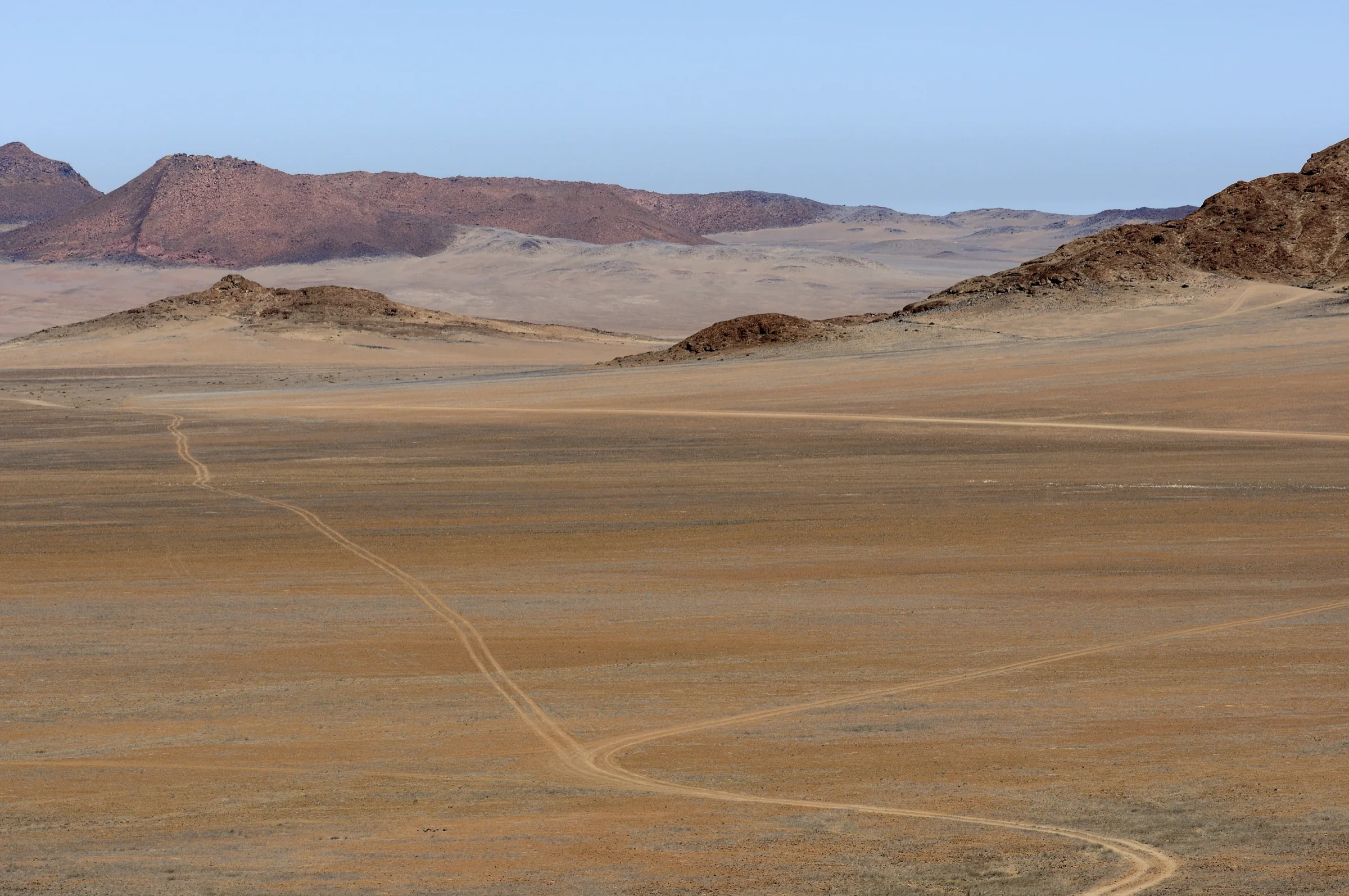 Vehicle tracks crossing the remote basin inside Messum Crater